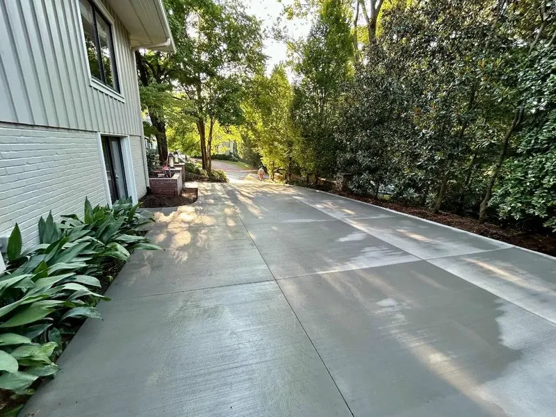 Finished broom-finish residential concrete driveway with clean control joints — Old North Concrete Co.