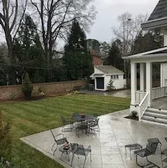 Backyard concrete patio set up for outdoor dining — Old North Concrete Co.